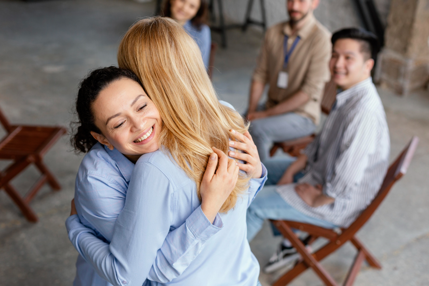 close-up-women-hugging-in-therapy